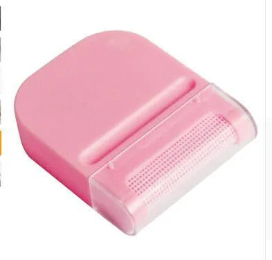Manual fuzz remover brush with removable catching net for clothes and sofas, compact plastic design