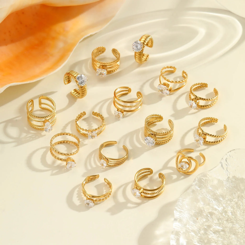 Gold electroplated stainless steel ring with zircon geometric designs and open mouth adjustable fitting