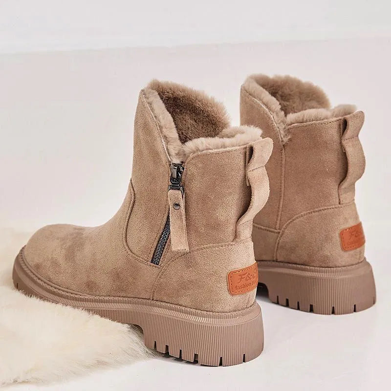 Women's black faux suede high-top snow boots with side zipper and thick plush lining.