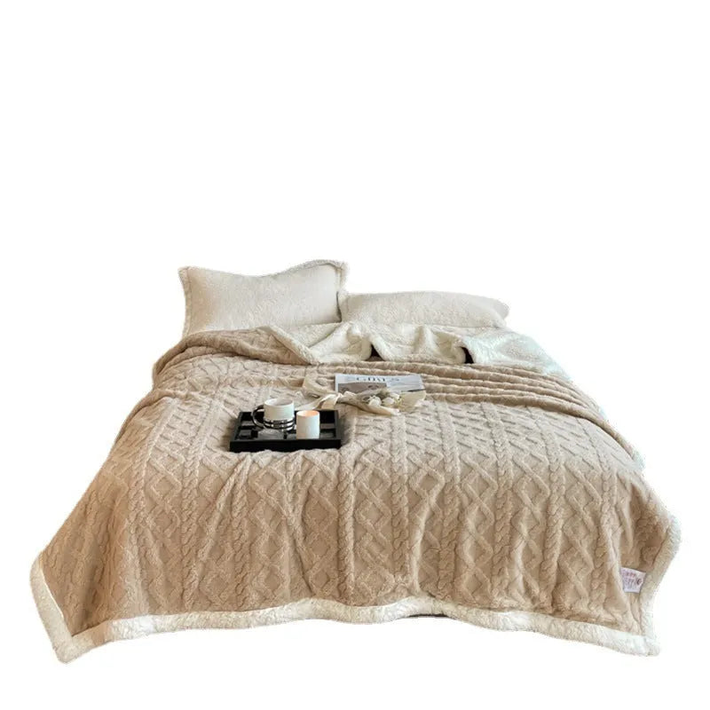 Polyester thermal flannel blanket in beige colour, shown folded to display its thick texture and modern style
