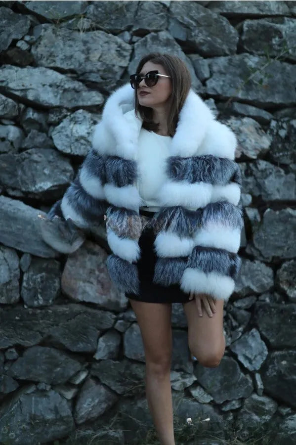 Loose-fitting hooded women's coat in artificial fur, shown in brown and white silver fox colours.