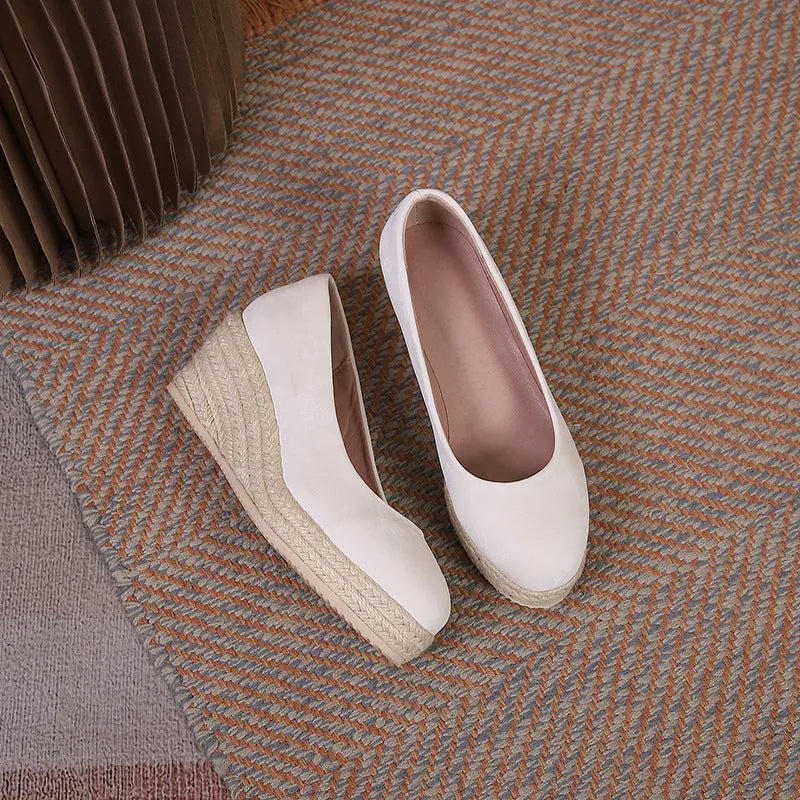 Women's apricot wedge heel pumps with rope detail around ankle and thick platform sole.