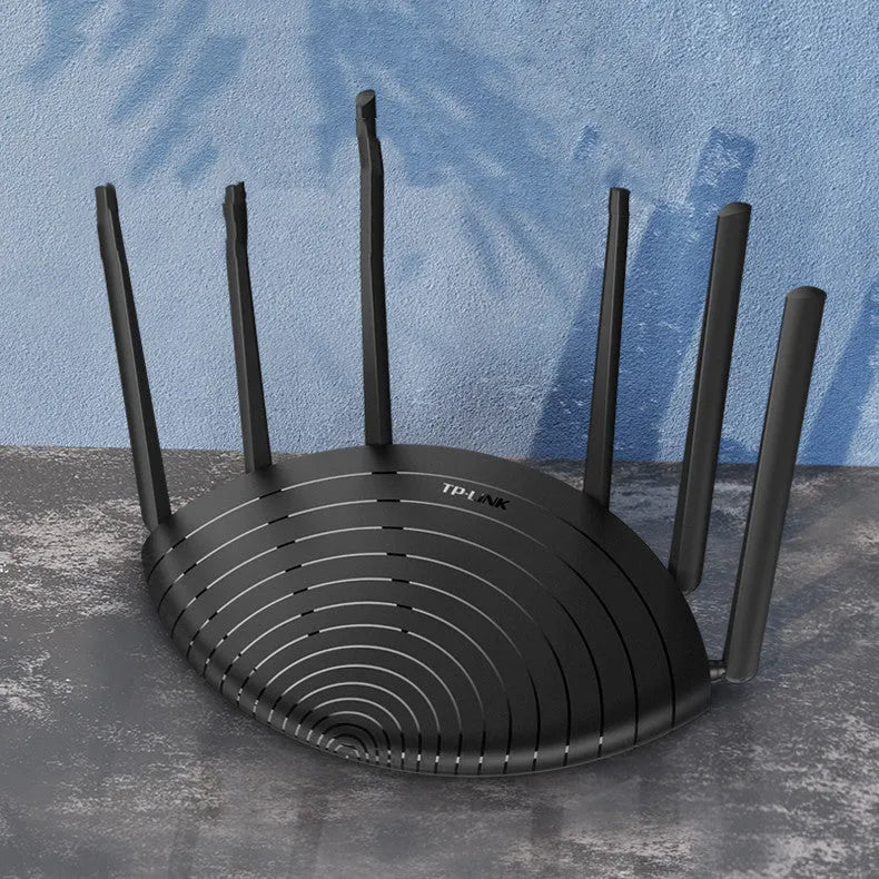 TP-Link TL-WDR7661 AC1900 Gigabit wireless router in black housing on a desk.