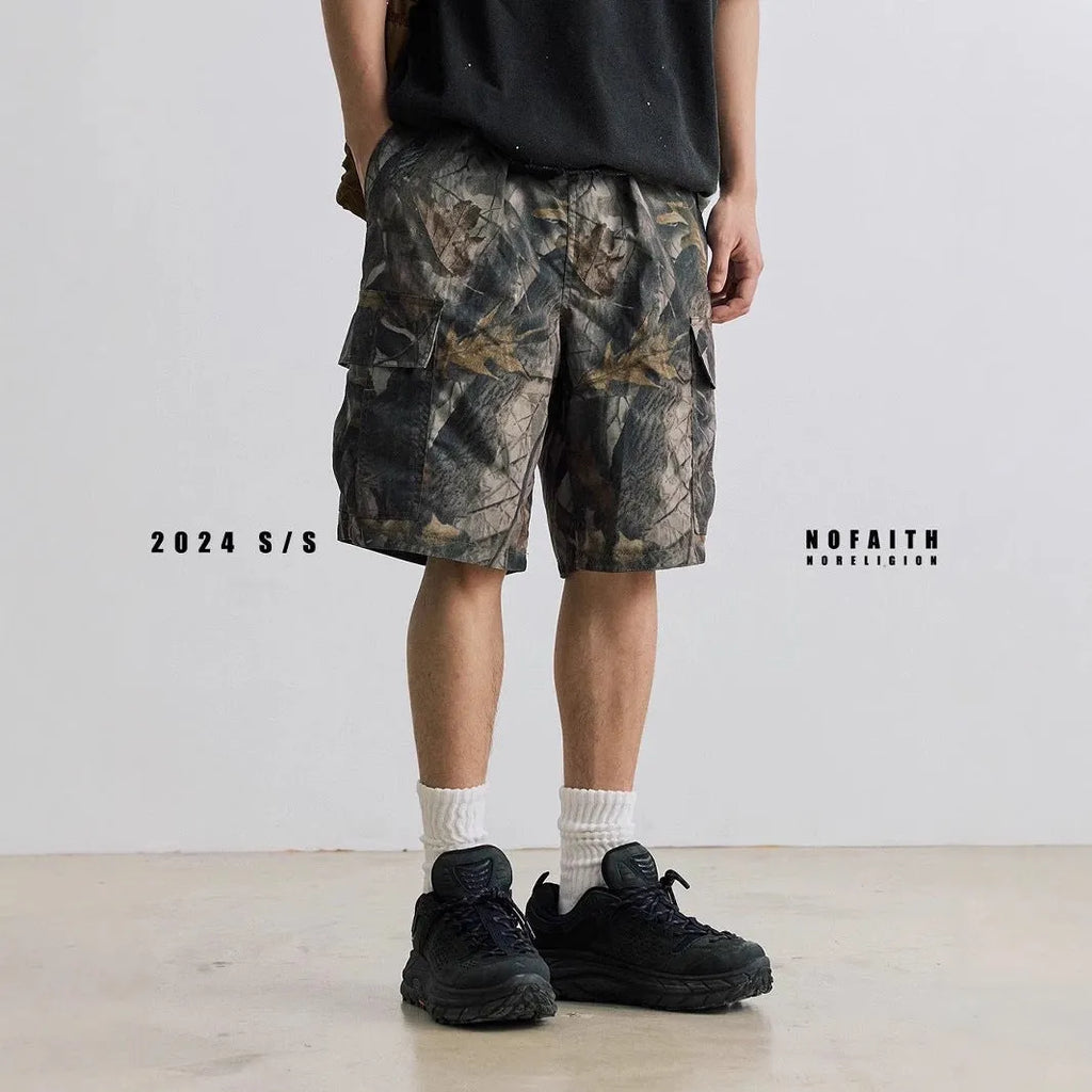 Men's loose fit straight-leg denim shorts in army green colour with a mid waist and zip fly.