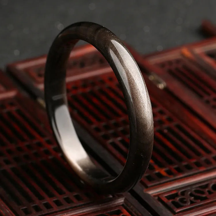 Natural silver stone cat's eye bracelet in ethnic national style, with geometric details and alloy setting.