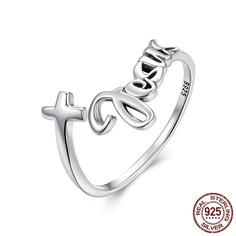S925 sterling silver cross letter open ring with oxidised finish and adjustable opening on neutral background