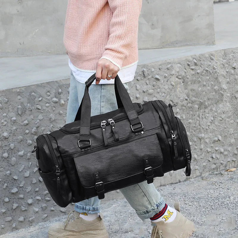 Large black travel bag with separate shoe compartment showing dimensions 52cm by 19cm by 27cm