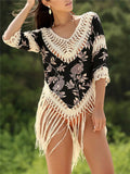 Women's apricot V-neck sun protection blouse with hollow-out design on a beach