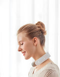 White electric acupressure massager device for back, neck and shoulder pain relief.