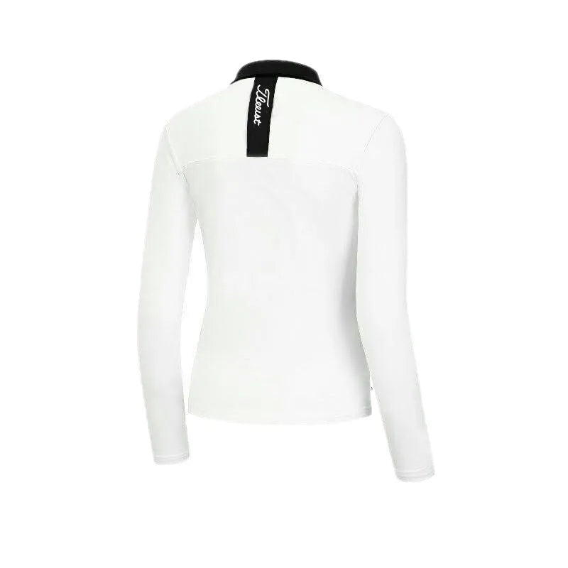 Women's slim-fit long sleeve golf top in black, made from breathable polyester fabric.