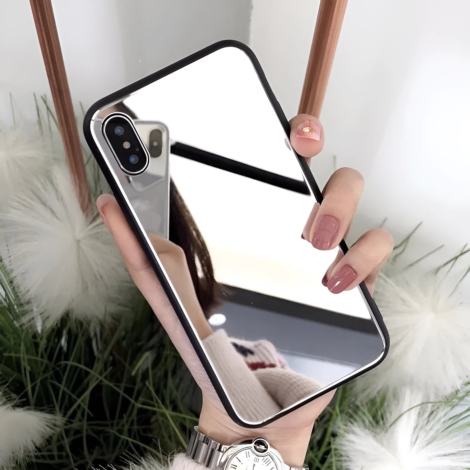 Black iPhone case with a built-in mirror on the back, compatible with iPhone X and iPhone 7 Plus models.