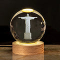 White crystal cross ornament with 6cm ball on wooden warm light base