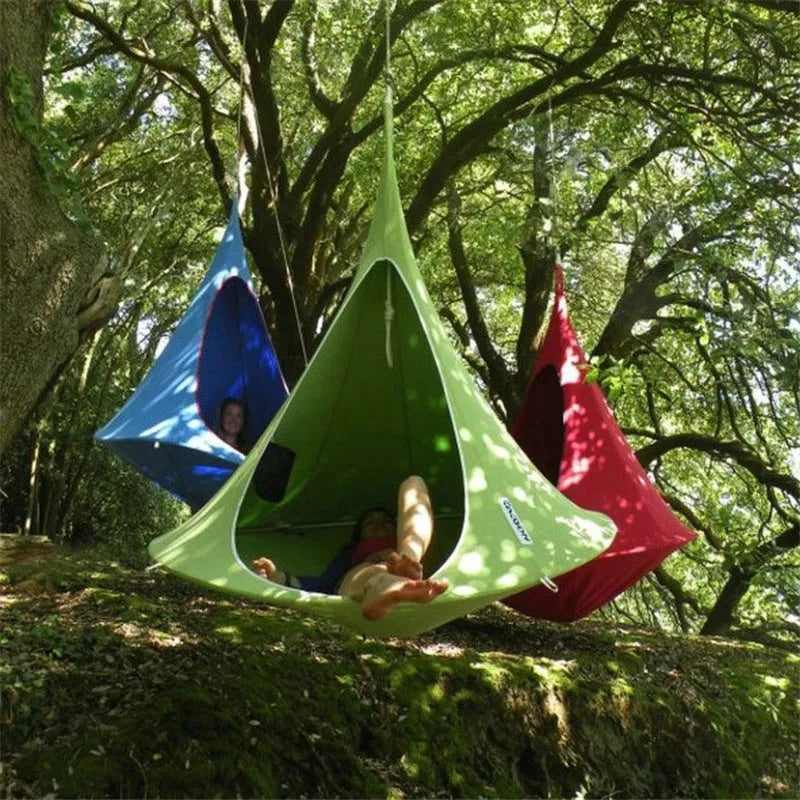 Lightweight portable flying saucer hammock in green oxford cloth with metal frame for camping and outdoor leisure