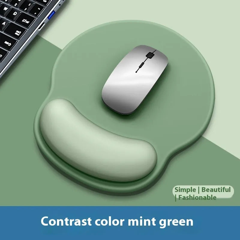 Silicone mouse mat with wristband in mint green colour on a desk