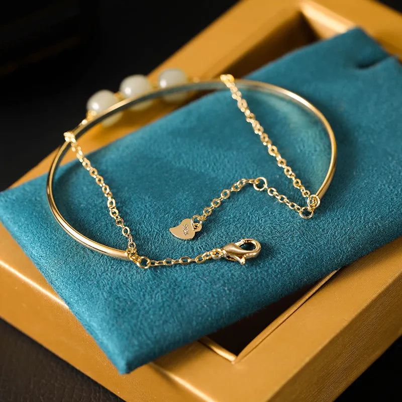 Women's Hetian jade lucky beads bracelet with gold inlay, showing single, double, and three bead style options.