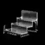 Transparent acrylic cosmetics storage rack with detachable shelves, displaying perfume bottles and small accessories