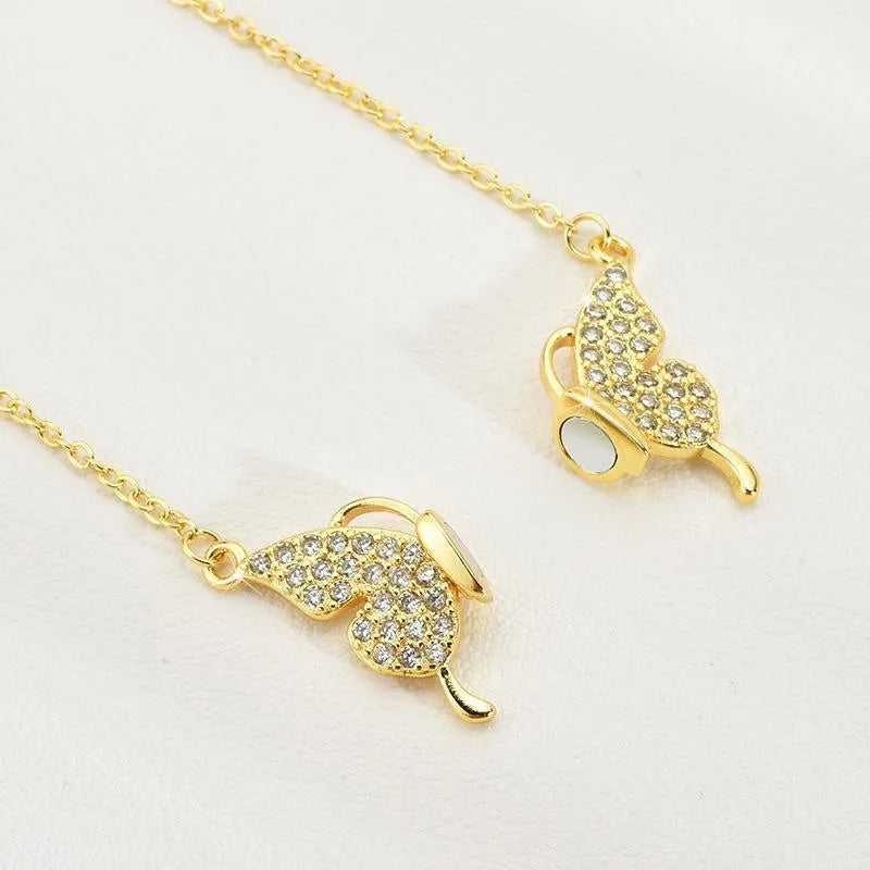 Women's titanium steel butterfly necklace with magnetic snap fastening in gold or silver finish