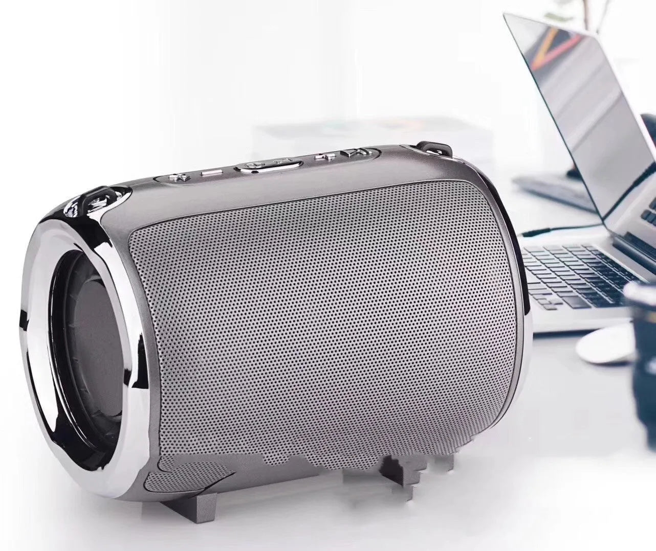Portable metal subwoofer speaker with buttons in black, blue, gold, red, or silver colours.