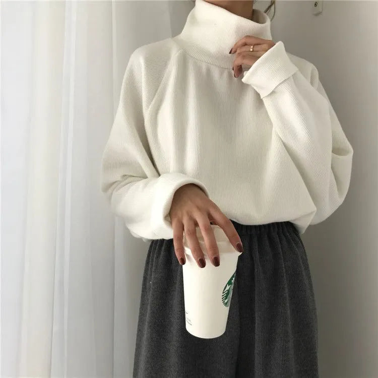 Women's loose fit long sleeve top with half-high collar in solid colours: white, apricot, black