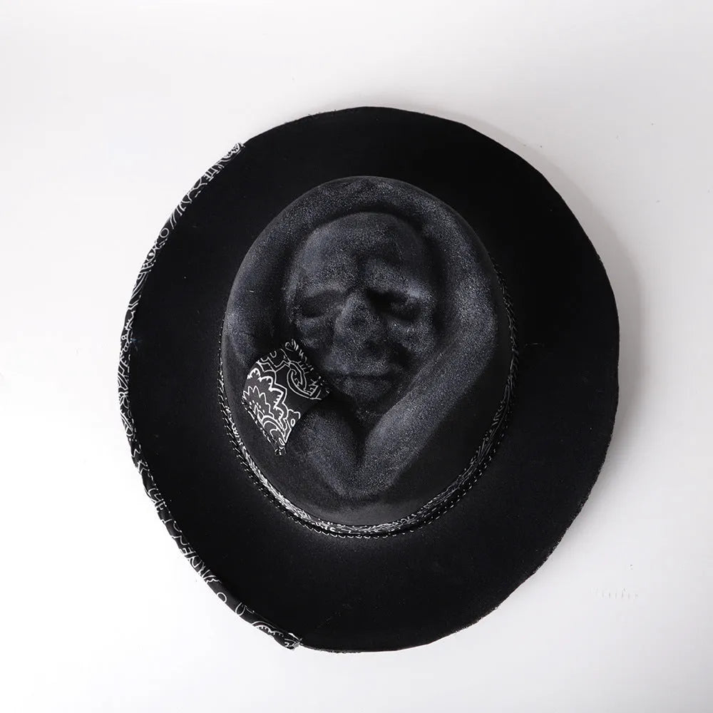 Handmade wool felt Halloween hat with conical crown and skull print, featuring denim fabric accents