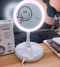 White foldable acrylic vanity mirror with LED lights and double-sided storage compartments