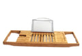 Bamboo bathtub frame shelf installed across tub edge for bathroom storage