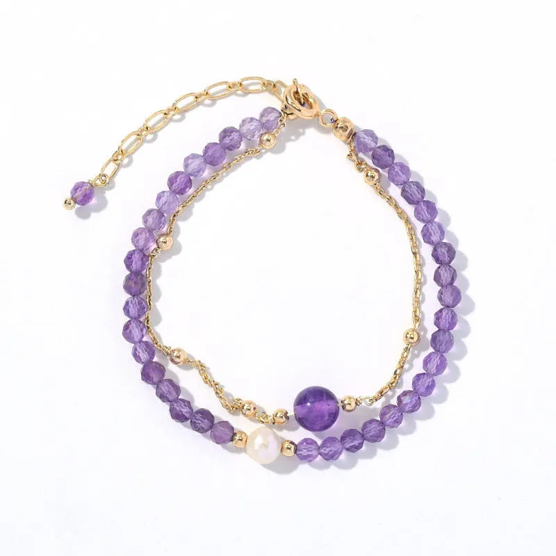 Chinese style women's bracelet with amethyst-coloured diamond-shaped crystals in electroplated metal setting