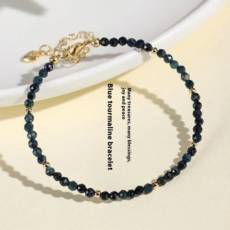 Women's blue tourmaline bracelet with 3mm beads and spacer design