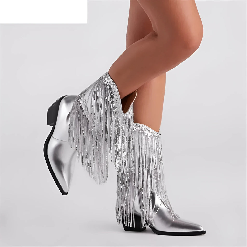 Women's black chunky heel tassel boots with a super high stiletto heel and pointed toe.