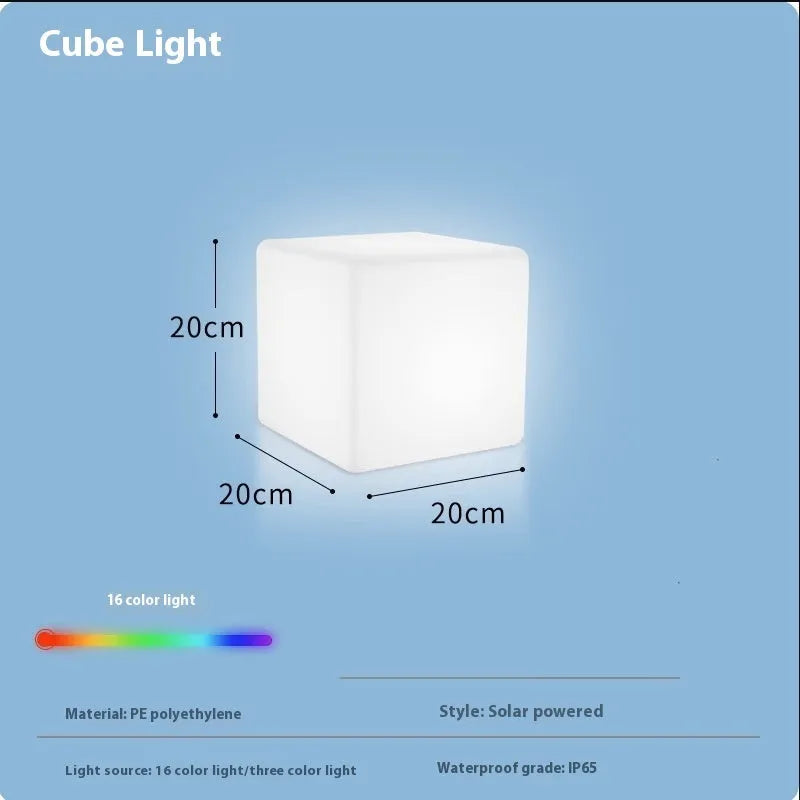 Modern white LED cube stool light outdoors, showing flat top and clean design.