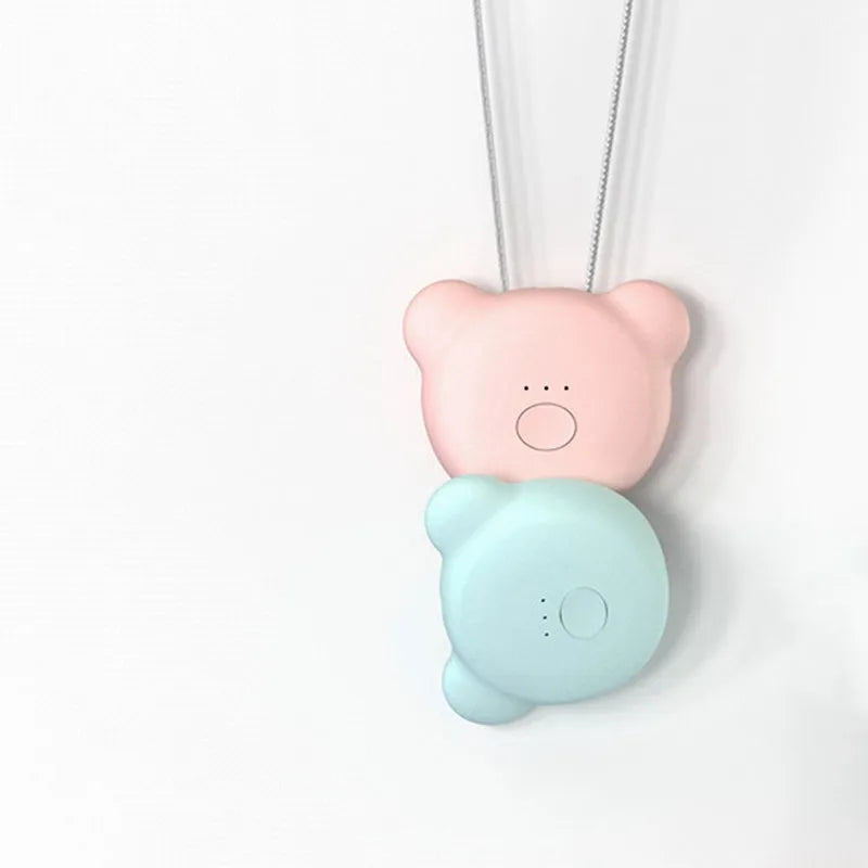 Mini USB portable air purifier necklace worn as a collar, showing pink and blue colour options.