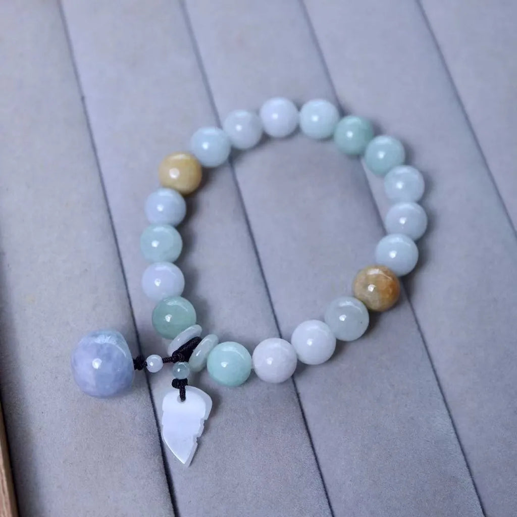 Natural jade Buddhist hanging bracelet showing geometric shape and symbolic charms