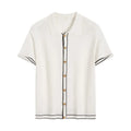 White cardigan with dark contrast lapels and short sleeves, laid flat.