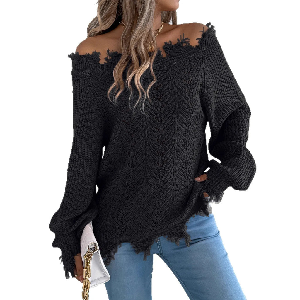 White women's hollow-out knit sweater with an off-the-shoulder neckline and long sleeves.