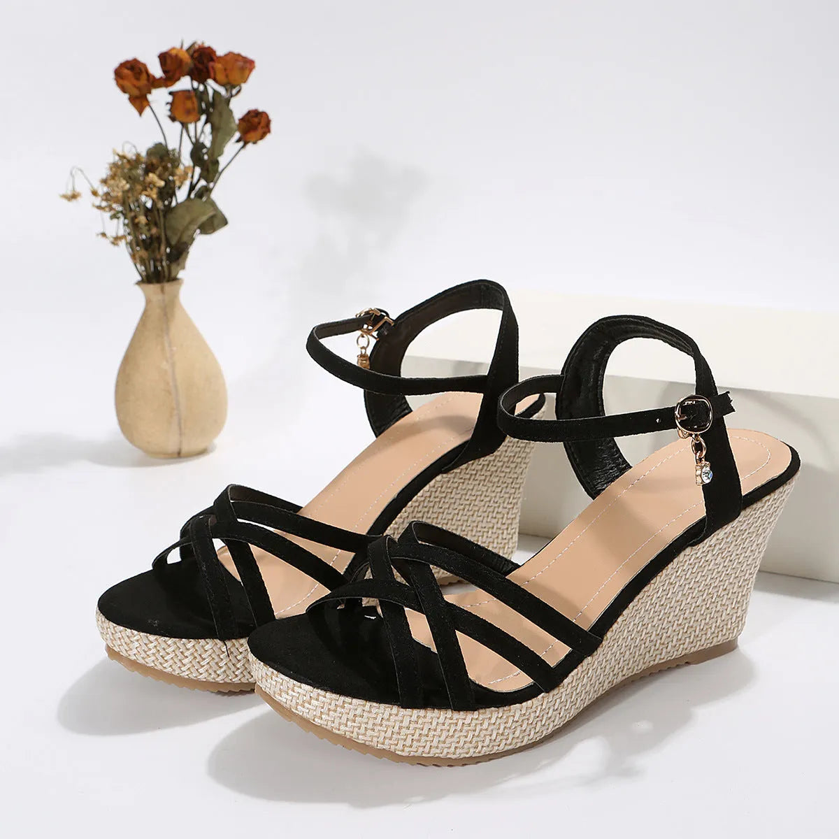 Women's beige wedge sandals with fish mouth toe and cloth upper, shown on a white background