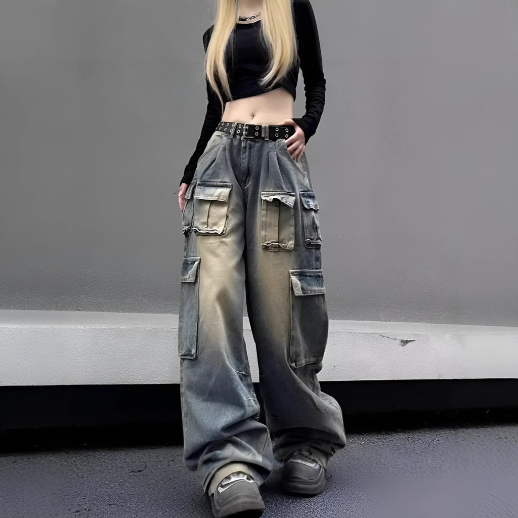 Loose fit light blue denim jeans with multiple pockets and a distressed washed finish on a neutral background.