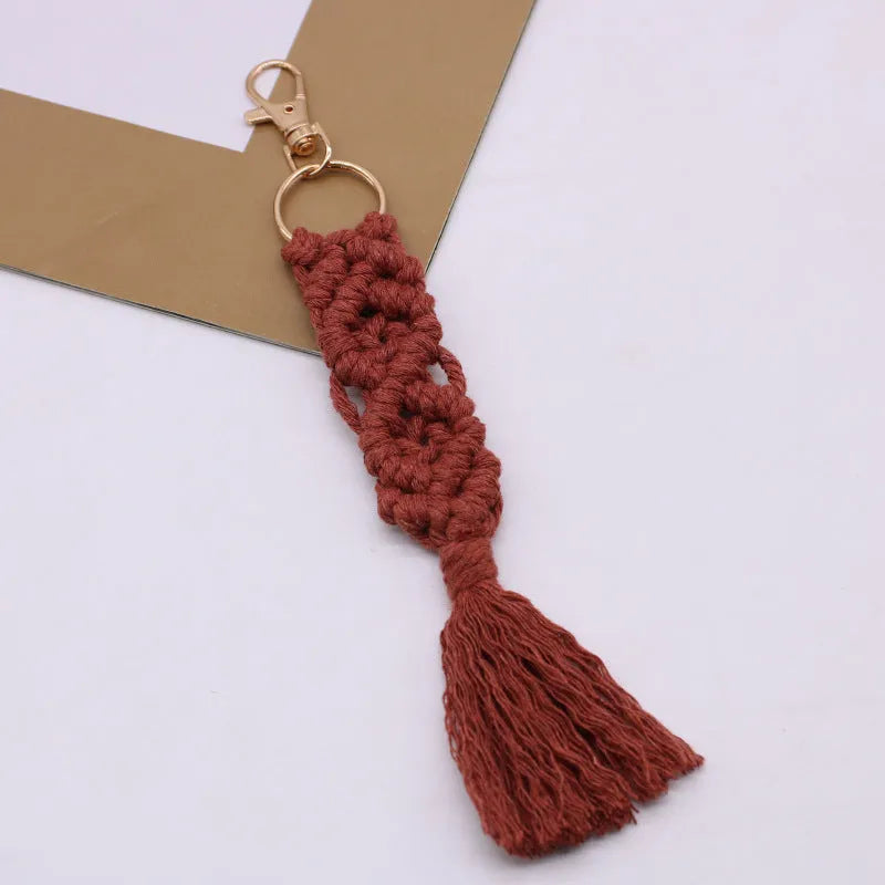 Hand-woven cotton tassel key chain in eight colours including brick red and rose pink for car keys and bag ornaments