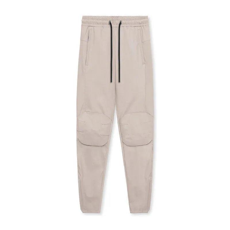 Men's grey ankle-tied running trousers for fitness exercise with quick-dry polyester fabric