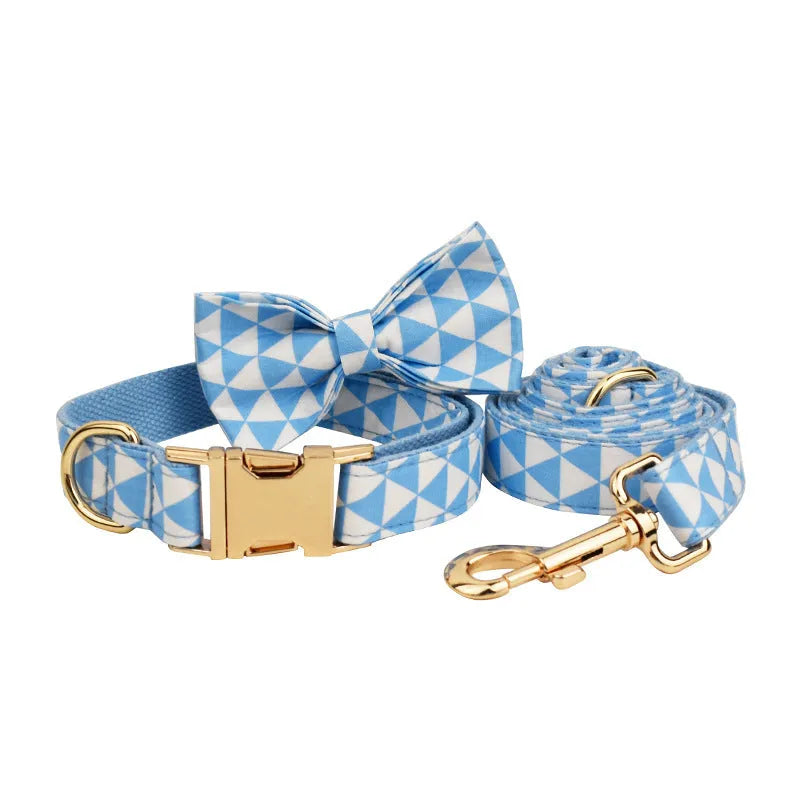 Blue cloth dog vest with triangular rope design, matching collar, leash and bow in a four-piece pet accessory set