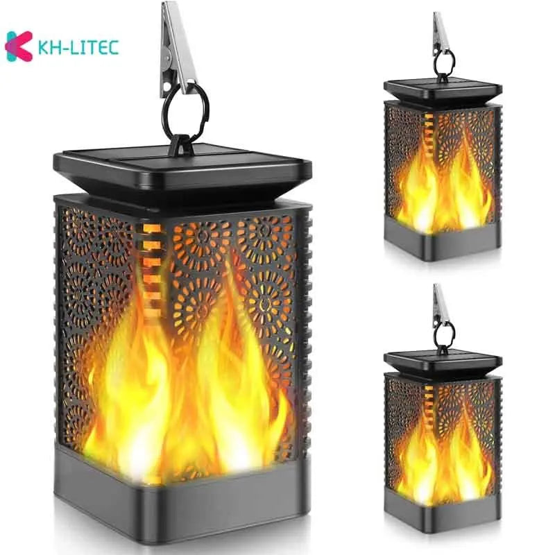 Black solar hanging flame torch LED light for outdoor garden and patio decoration.