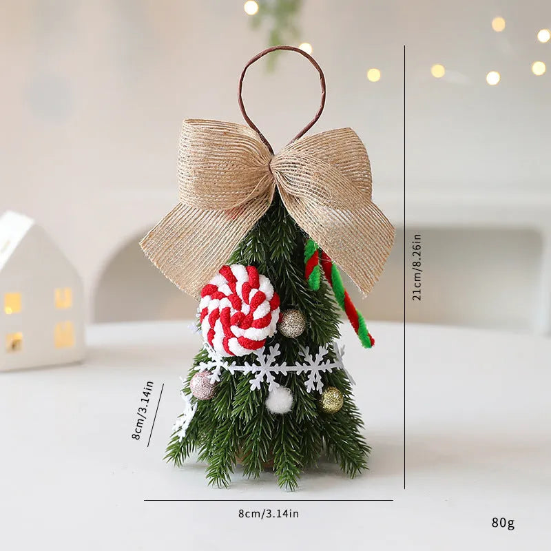 Mini Christmas tree ornament in red and white snowflake design on a tree branch