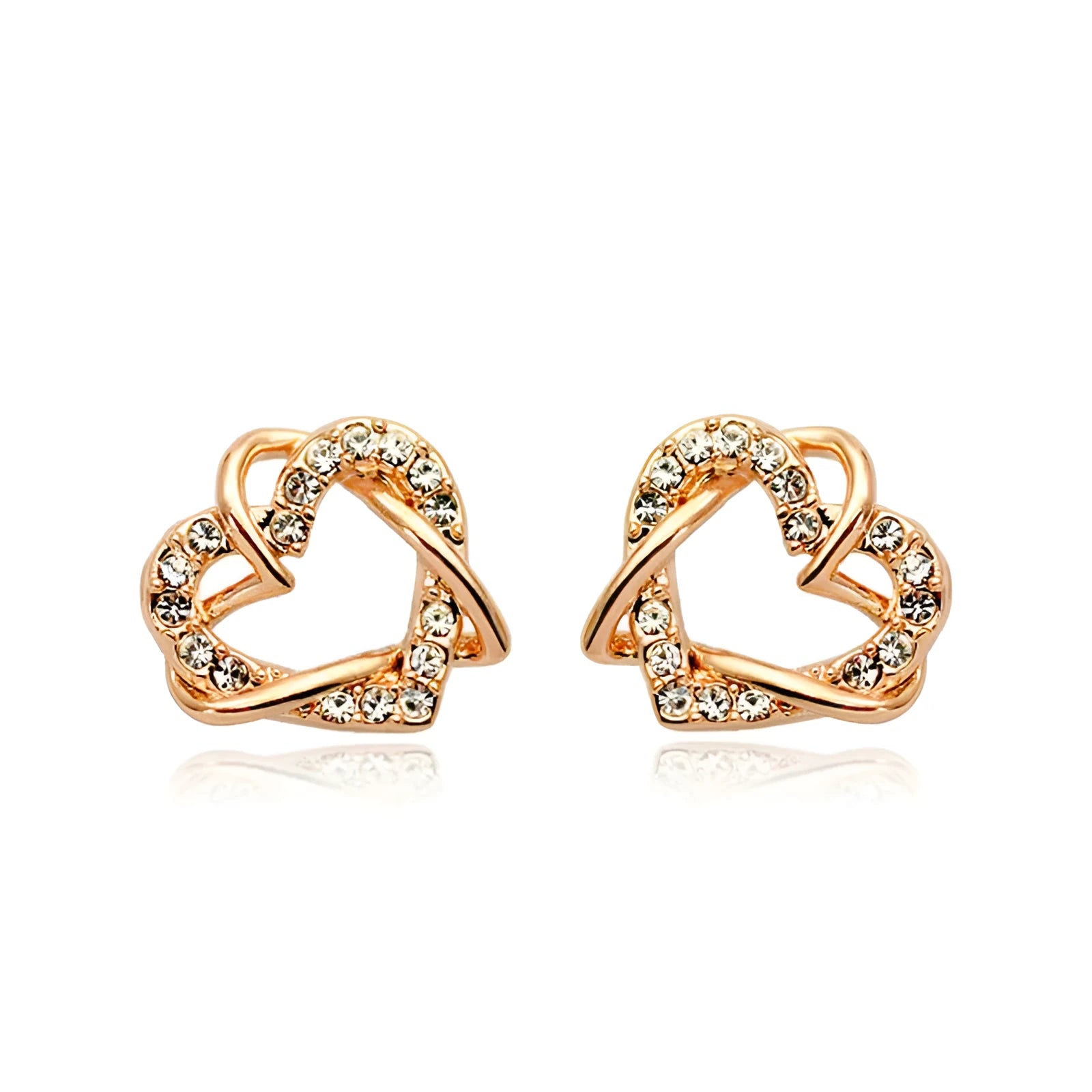 Gold colour alloy heart-shaped stud earrings on white background