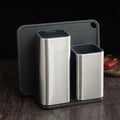 Black and white PP kitchen tool holder with detachable base, holding knives and utensils.