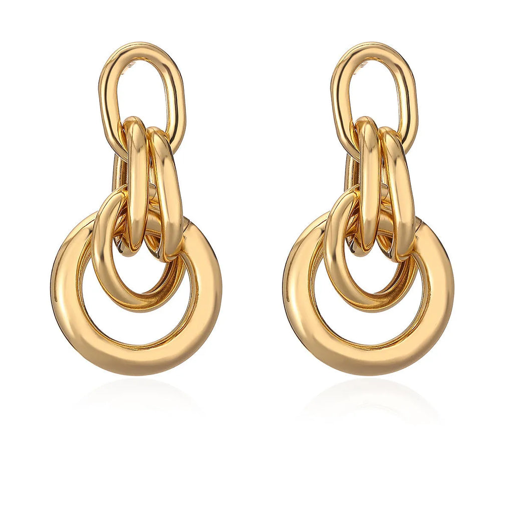 A pair of gold geometric earrings for women with an irregular shape, made from copper.