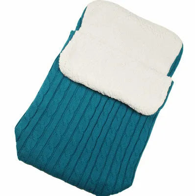 Envelope-style baby stroller sleeping bag in a choice of colours with cotton wool filling.