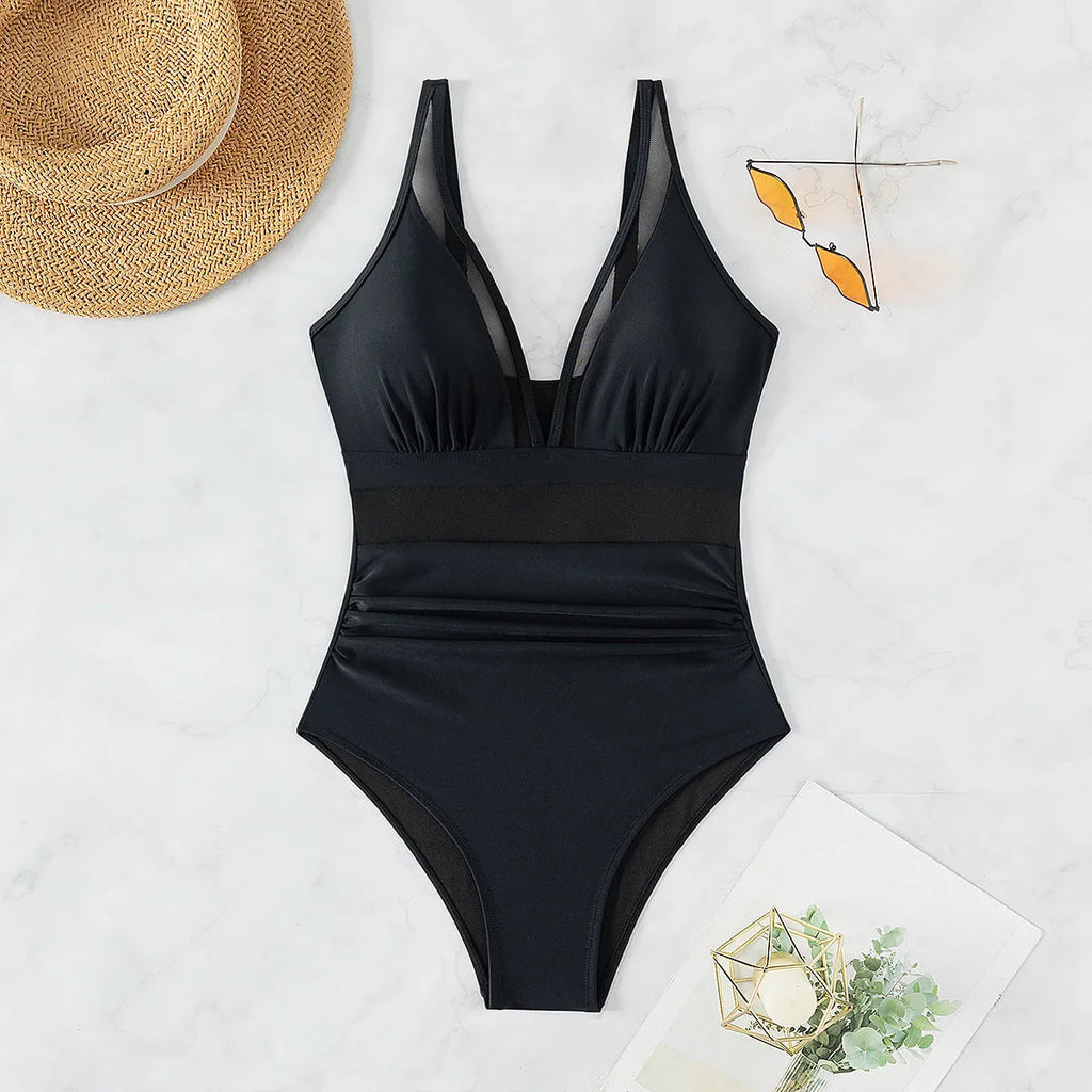 Black nylon mesh halter one-piece swimsuit with briefs bottom for women.