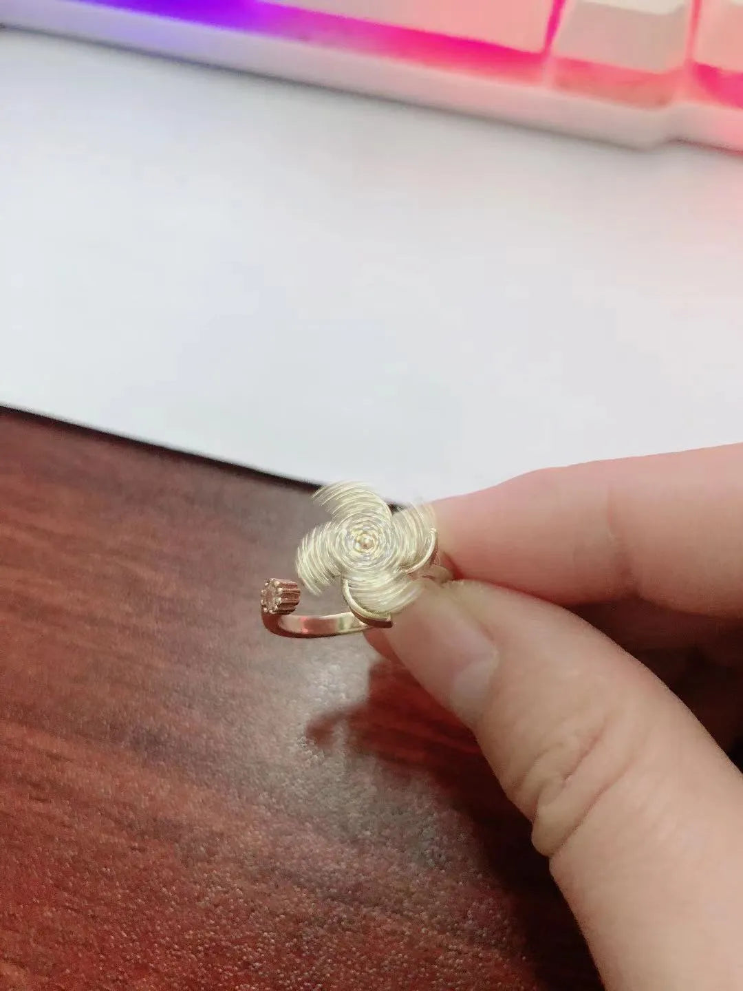 Rotating copper ring with micro-inlaid windmill design in gold or silver electroplated finish
