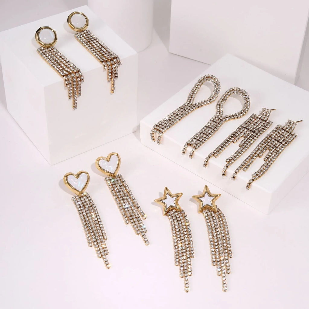Stainless steel earrings with diamond tassel designs in heart, star and geometric shapes with 18K electroplated finish