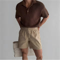 Men's loose fit cotton sports shorts in black, white, or khaki for summer wear