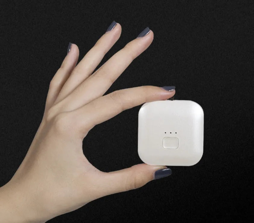 Mini USB portable air purifier necklace worn as a collar, showing pink and blue colour options.
